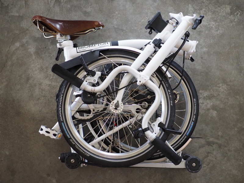 The Super-Invaluable Brompton folding bicycle Image of folded Brompton Bicycle